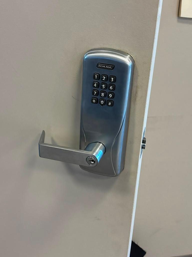 Schlage commercial keypad lever installed on entry door.