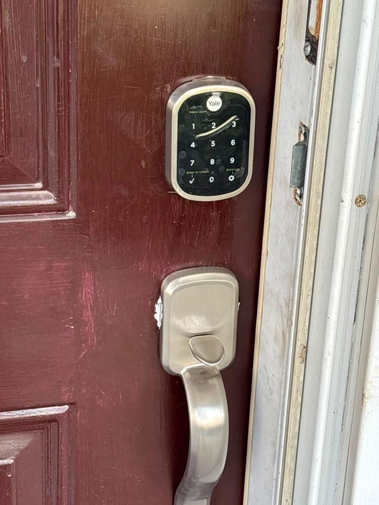 Yale smart lock installed on residential entry door.